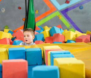 Portrait of boy with toy toys