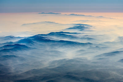 Aerial shot of the serbian highlands covered by fog