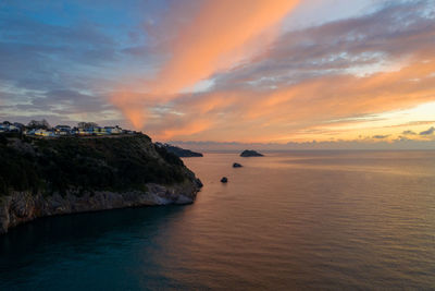 Scenic view of sea against sky during sunset
