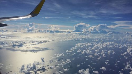 Aerial view of landscape against cloudy sky