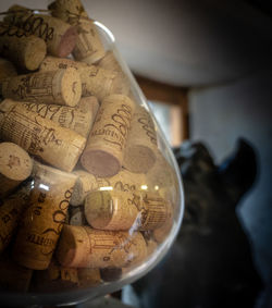 Close-up of wine bottles on wooden table