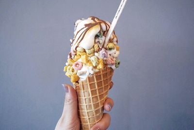 Close-up of hand holding ice cream