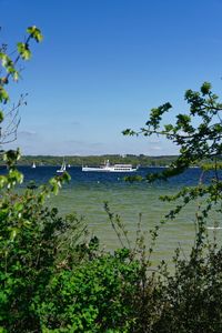 Scenic view of sea against clear blue sky