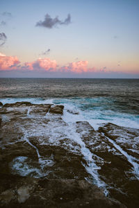 Scenic view of sea against sky during sunset