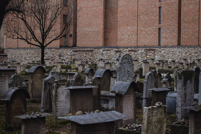 View of cemetery against built structure