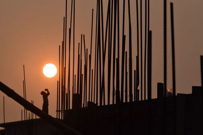 Silhouette of city at sunset