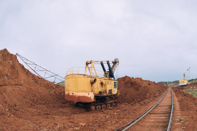 Train on railroad track against sky