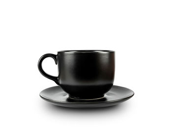 Close-up of coffee cup against black background