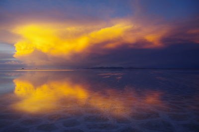 Scenic view of sea against orange sky