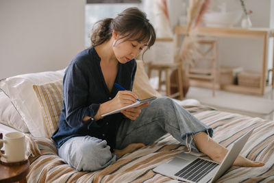 Woman preparing strategy while working at home