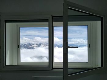 Cloudy sky seen through glass window