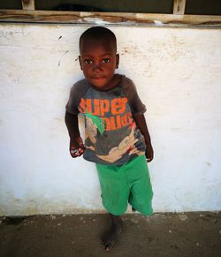 Portrait of boy standing outdoors