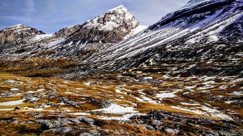 Scenic view of snowcapped mountains against sky