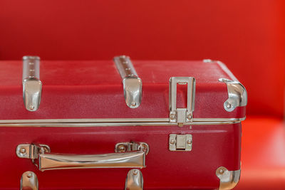 Close-up of red suitcase