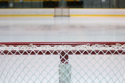 Close-up of goal post at ice hockey rink