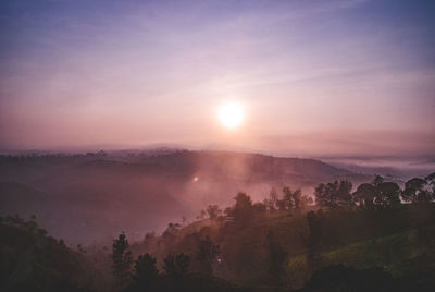 Scenic view of landscape against sky during sunset