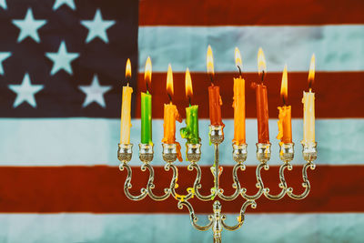 Close-up of illuminated flag on table