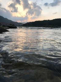 Scenic view of lake against sky during sunset