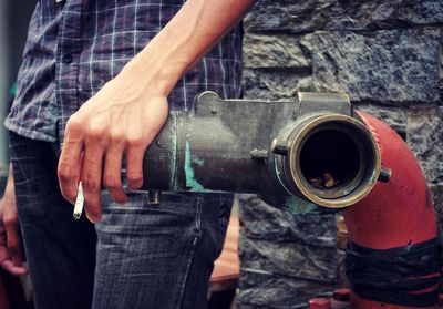 Close-up of man holding camera