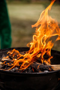 Fire flame texture on barbecue and behind green blurred background