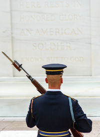 Rear view of man standing on floor