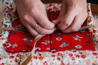 Midsection of woman with hands on table