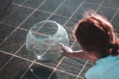 Rear view of boy playing with bubbles