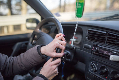 Close-up of man hand holding car