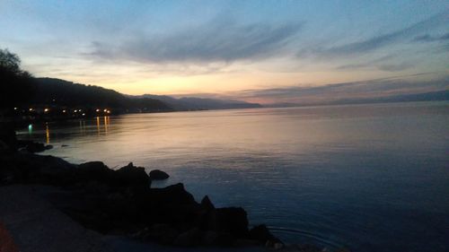 Scenic view of sea against sky at sunset