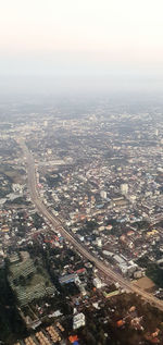 Aerial view of city buildings against sky