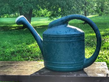 Close-up of metallic structure against trees