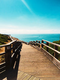 Sun over portugal ocean view from bridge