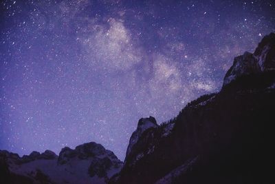 Low angle view of mountain against sky at night