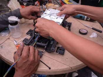 High angle view of people working on table
