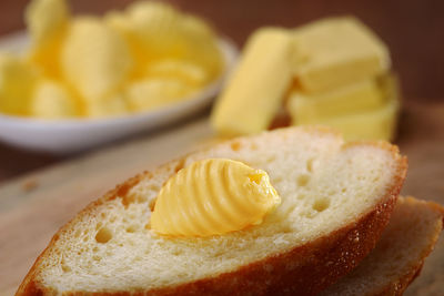 Close-up of butter on bread at table