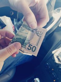 Close-up of hand holding paper