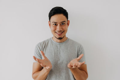 Portrait of young man against white background