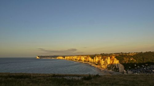 Scenic view of sea against clear sky during sunset