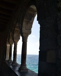 View of sea seen through arch