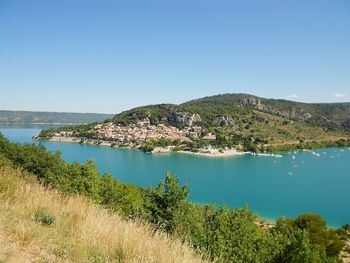 Scenic view of sea against clear blue sky