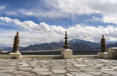 Sculpture on mountain against sky