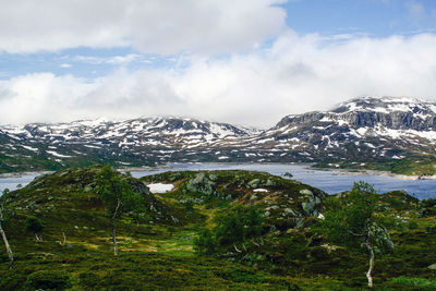 Scenic view of snowcapped mountains against sky