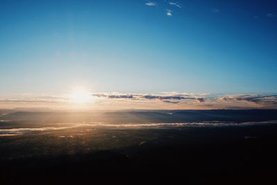 Scenic view of landscape against blue sky