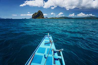 Sailboat in sea against sky