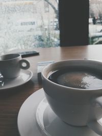 Close-up of coffee cup on table