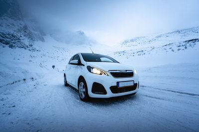 View of car on snow covered mountain