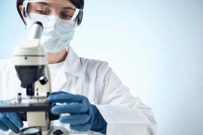 Scientist wearing mask at laboratory