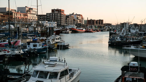 Boats moored at harbor