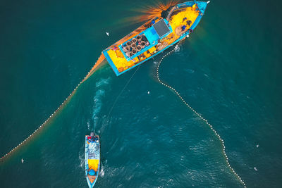 High angle view of painting floating on sea