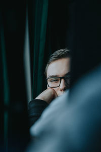 Portrait of young man in train